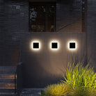 Modern outdoor wall lights illuminating a dark brick facade, highlighting architectural design. Energy-efficient LED lighting for contemporary exteriors.