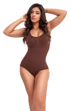 Brown sleeveless bodysuit on model, showcasing seamless design and comfortable fit. Perfect for casual wear or layering. Fashionable women's clothing.