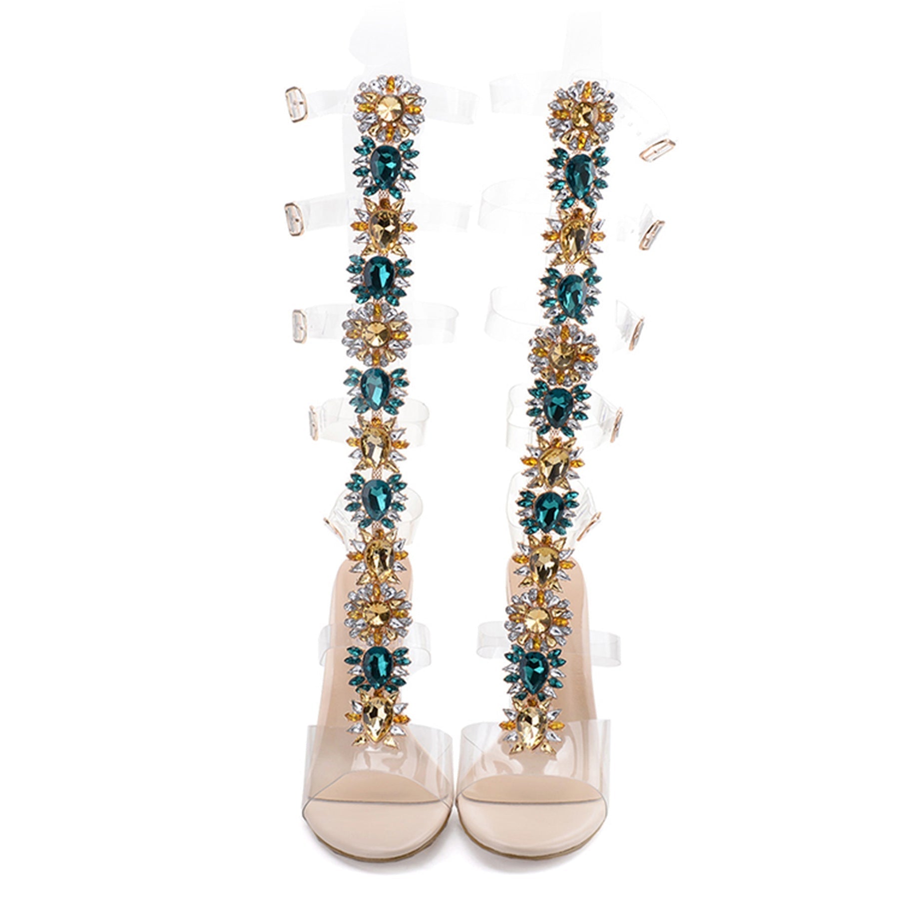 Elegant high-heeled sandals with clear straps, adorned with intricate floral embellishments in teal and gold, perfect for stylish evening wear.