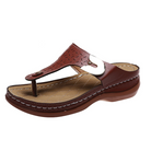 Brown leather thong sandal with cushioned sole, white stitching, and decorative cutout design. Comfortable footwear for casual wear.