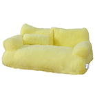 Yellow plush pet sofa bed with bolster pillow, soft and cozy design, perfect for small dogs and cats, luxury pet furniture, washable cover.