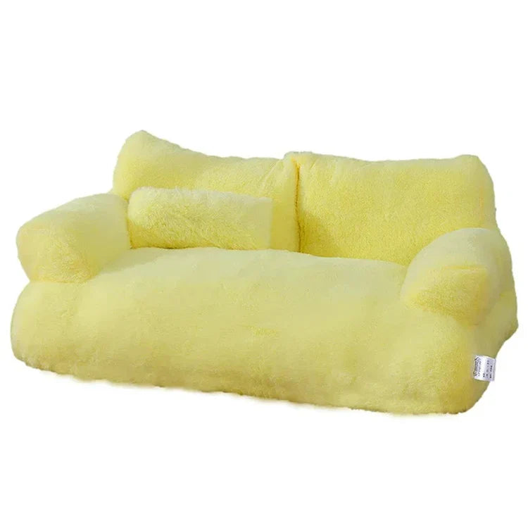 Yellow plush pet sofa bed with bolster pillow, soft and cozy design, perfect for small dogs and cats, luxury pet furniture, washable cover.