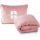 Pink travel blanket set with a compact pillowcase featuring a white airplane and suitcase design. Ideal for comfortable travel and easy packing.