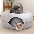 Cozy gray cat bed with two cats; one sitting on top, another peeking from inside. Perfect pet furniture for comfort and style in modern homes.