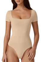 Beige short-sleeve bodysuit with square neckline, seamless design, and fitted style. Perfect for casual wear or layering. Fashion essentials.