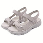 Beige orthopedic sandals with adjustable Velcro straps, cushioned sole, and ergonomic design for comfort and support. Ideal for walking and casual wear.