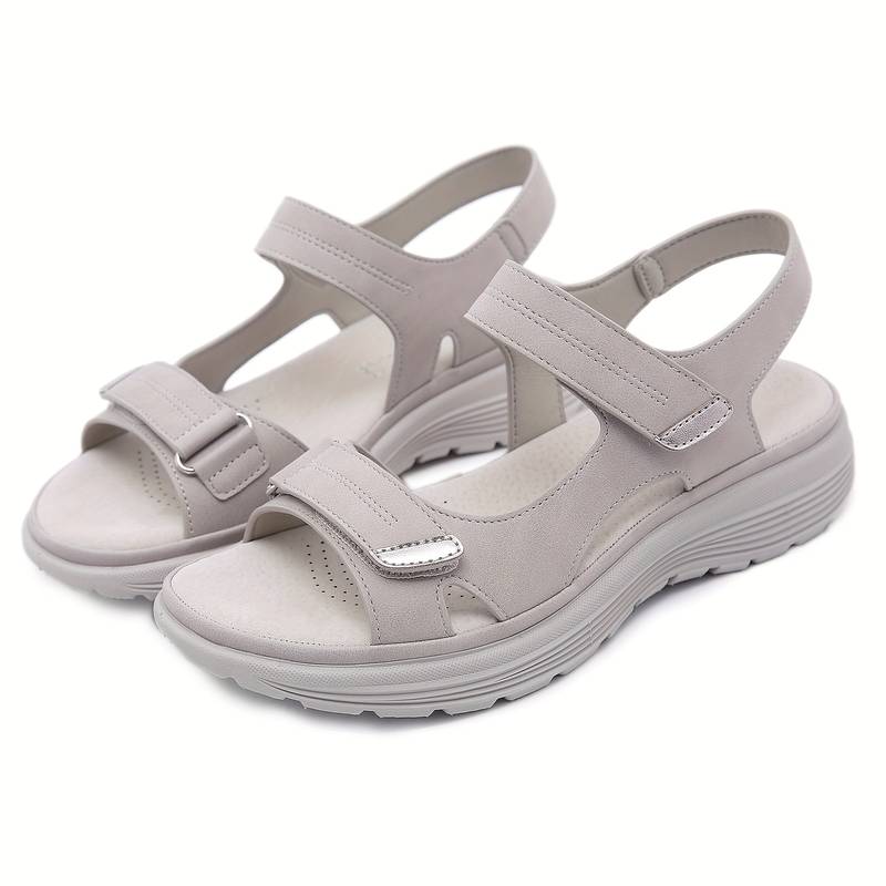 Beige orthopedic sandals with adjustable Velcro straps, cushioned sole, and ergonomic design for comfort and support. Ideal for walking and casual wear.