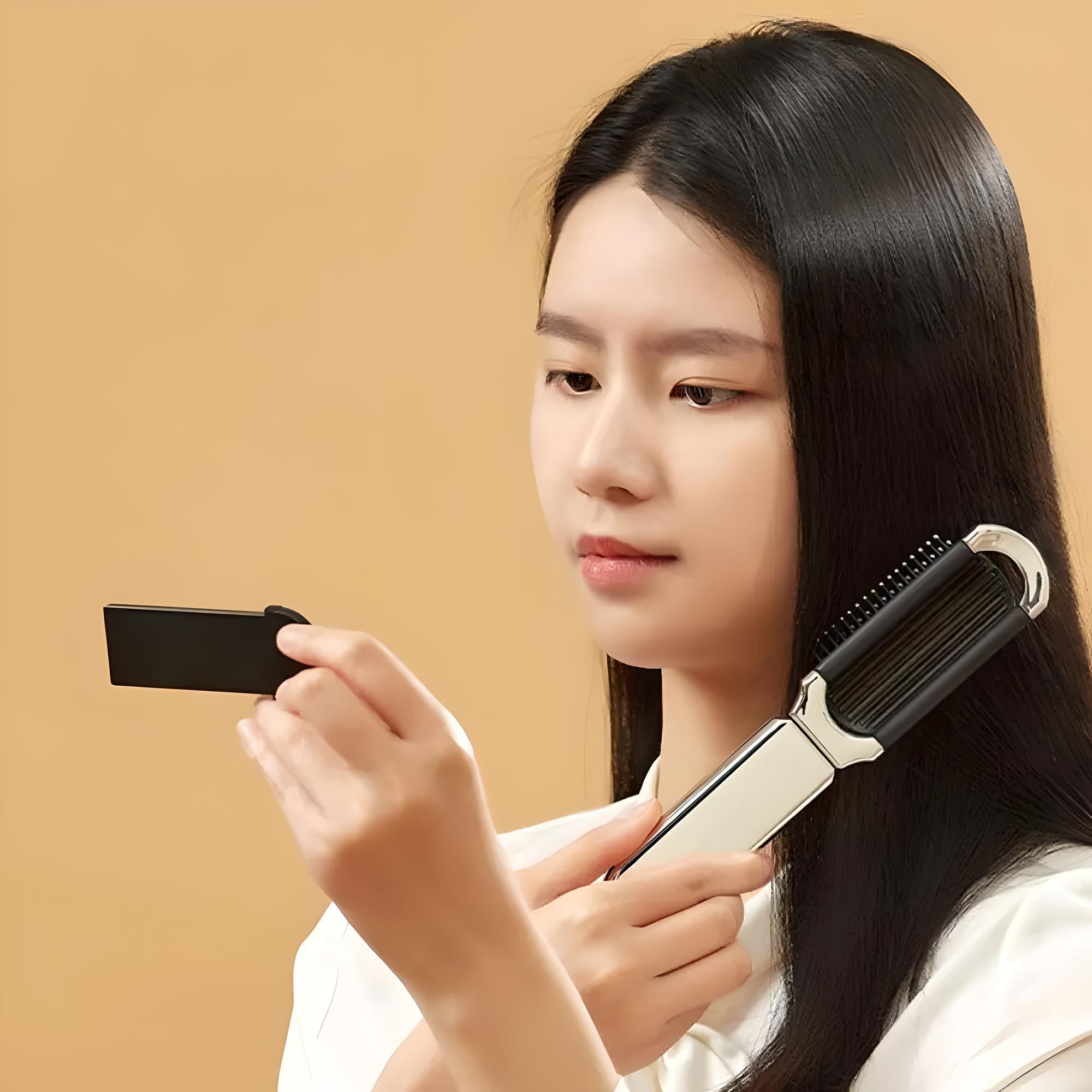 Woman using a hair straightening brush on brown background, examining a black card. Hair care tool, beauty routine, sleek hair styling.