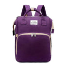 Purple backpack with front zipper pocket, top handles, and adjustable straps. Features "You Are My Sunshine" label. Ideal for school or travel.