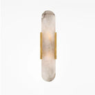 Modern wall sconce with elongated marble design and brass accents, ideal for contemporary home lighting. Elegant, minimalist decor, ambient illumination.