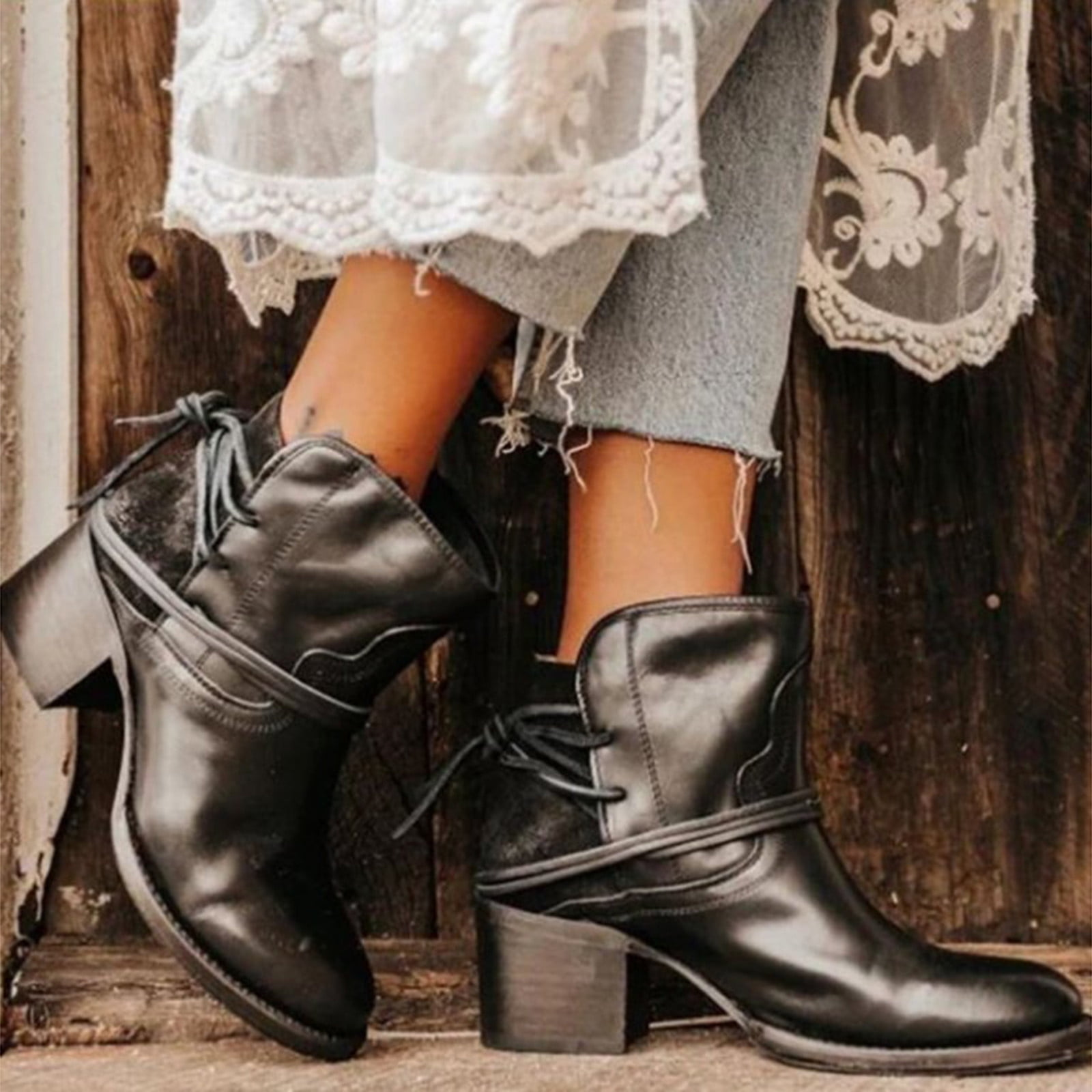 Black leather ankle boots with block heels, worn with lace-trimmed dress and jeans. Stylish women's footwear, perfect for casual and chic outfits.