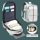 White travel backpack with multiple compartments, featuring a dedicated shoe compartment, organized interior pockets, and sleek design for efficient packing.