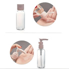 Clear plastic pump bottle for liquid soap or lotion, shown dispensing product onto hands. Ideal for travel, refillable, leak-proof design.