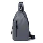 Sleek gray waterproof sling backpack with adjustable strap, front zipper pocket, and modern design. Ideal for travel, hiking, and daily use.