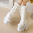 White faux fur knee-high platform boots with chunky heels and lace-up design, perfect for winter fashion. Trendy women's footwear, stylish and cozy.