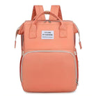 Peach-colored fashion backpack with "You Are My Sunshine" text, featuring multiple compartments and adjustable straps. Ideal for travel and daily use.