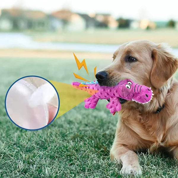 Golden Retriever playing with a pink dinosaur squeaky toy on grass, featuring durable stitching. Dog toy, pet playtime, outdoor activity.