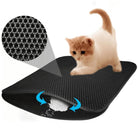 Cat litter mat with honeycomb design, featuring a ginger cat. Efficiently traps litter, easy to clean, waterproof, non-slip, durable pet accessory.