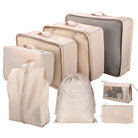 Beige travel packing cubes set, 8-piece luggage organizers with mesh tops, drawstring bag, and toiletry pouch. Ideal for efficient suitcase organization.