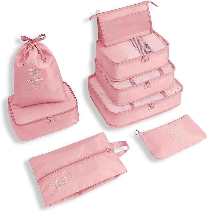 Pink travel packing cubes set, includes drawstring bag, zippered pouches, and stackable organizers. Ideal for luggage organization and efficient packing.