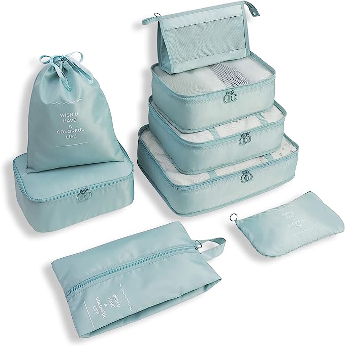 Light blue travel packing cubes set with various sizes, including a drawstring bag and zippered pouches, ideal for organized luggage and efficient packing.