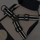 Reflective dog harness with adjustable straps and secure buckle, ideal for outdoor pet safety. Durable design enhances visibility in low-light conditions.