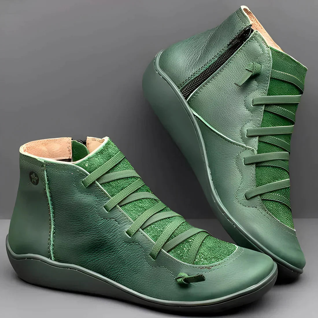 Green leather high-top sneakers with side zippers and unique lace design, featuring a comfortable sole. Stylish footwear for casual wear.
