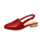 Red slingback flat shoe with textured leather pattern, low wooden heel, and adjustable strap. Perfect for casual and formal wear. Fashion footwear.