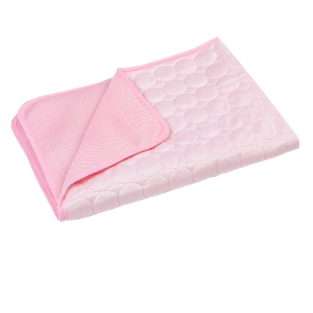 Pink quilted baby changing mat with circular pattern, soft and foldable, ideal for travel. Portable diaper pad, waterproof, easy to clean.