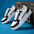 Black and white athletic sneakers with thick soles, displayed against a vintage radio backdrop. Stylish casual footwear for men and women.