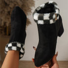 Black suede ankle boots with chunky heels, featuring a black and white plaid faux fur trim and side zipper. Stylish women's winter footwear.