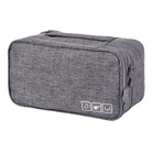 Gray travel shoe bag with zipper, durable fabric, and icons indicating water resistance and shoe storage. Ideal for organizing footwear on trips.