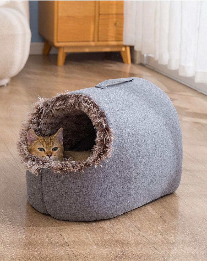 Cozy cat in a plush, gray pet bed with faux fur lining, placed on a wooden floor. Ideal for pet comfort, indoor cat furniture, stylish pet accessories.