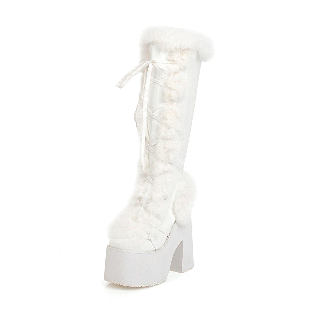 White knee-high platform boot with faux fur trim and lace-up design, featuring chunky heel. Stylish winter footwear, trendy fashion accessory.