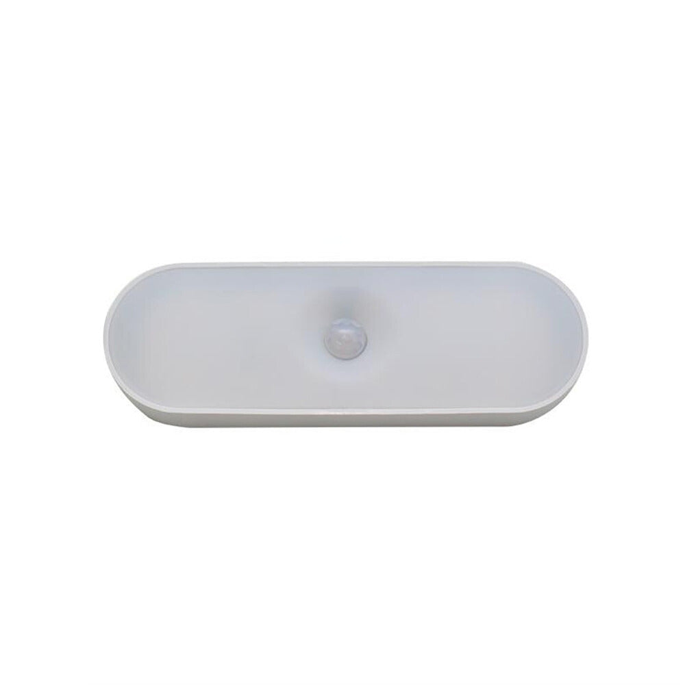 Oval white ceramic bathroom sink basin, minimalist design, top view. Ideal for modern bathroom vanities. Durable, sleek, and easy to clean.