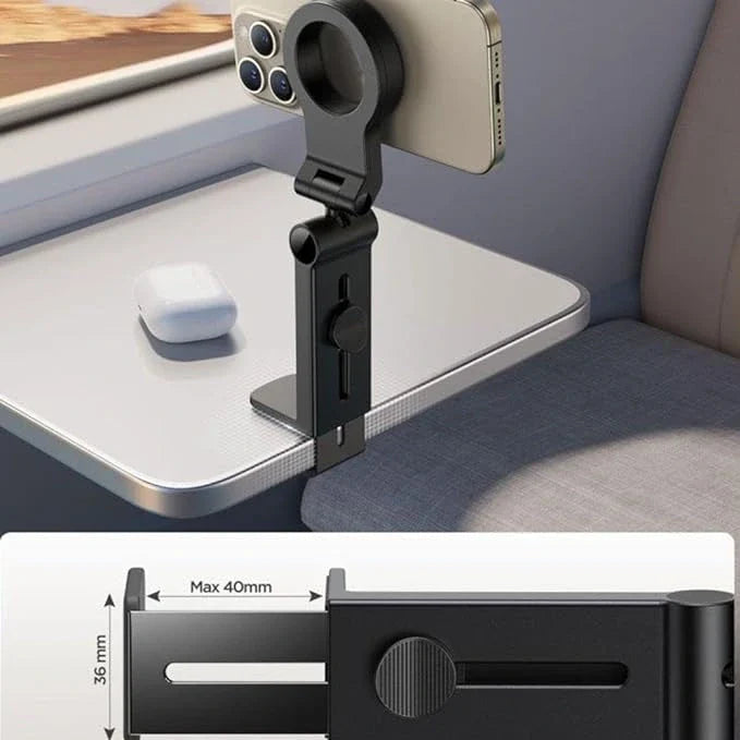 Adjustable airplane phone holder clamped to tray table, holding smartphone. Compact travel accessory for hands-free viewing. Ideal for flights.