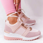 Pink orthopedic sneakers with white soles, designed for comfort and style. Ideal for reducing foot pain. Perfect for casual wear and active lifestyles.