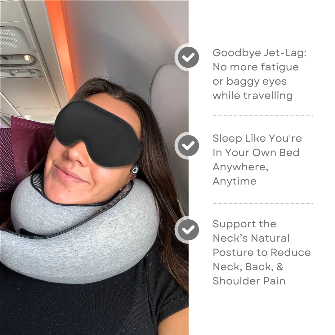 Woman wearing a black sleep mask and gray neck pillow on an airplane; benefits of travel accessories for reducing jet lag, improving sleep, and neck support.