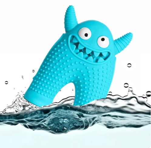 Blue monster-shaped dog chew toy with textured surface, floating in water. Durable pet toy for dental health and interactive play.