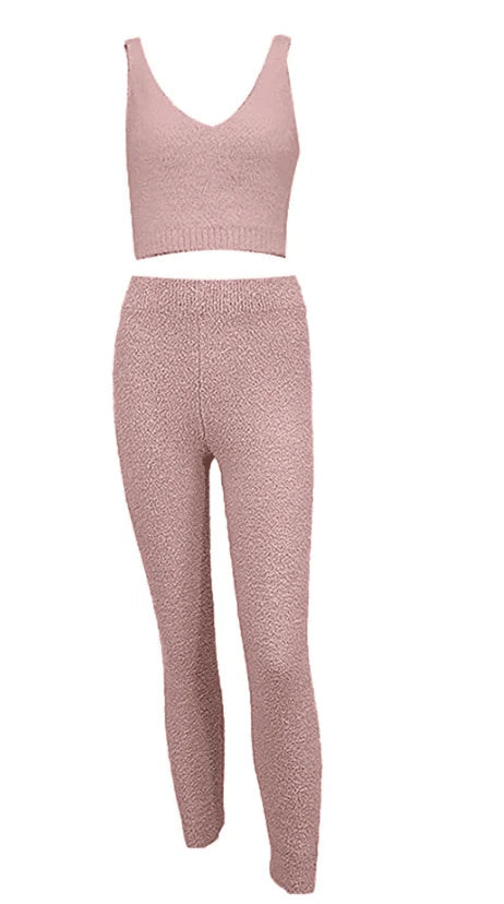 Cozy pink loungewear set, featuring a sleeveless crop top and high-waisted pants, perfect Skims dupe for comfortable home wear.