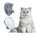 Electric cat massager with rotating brushes next to a fluffy white cat. Ideal for pet relaxation and grooming. Perfect cat accessory for stress relief.