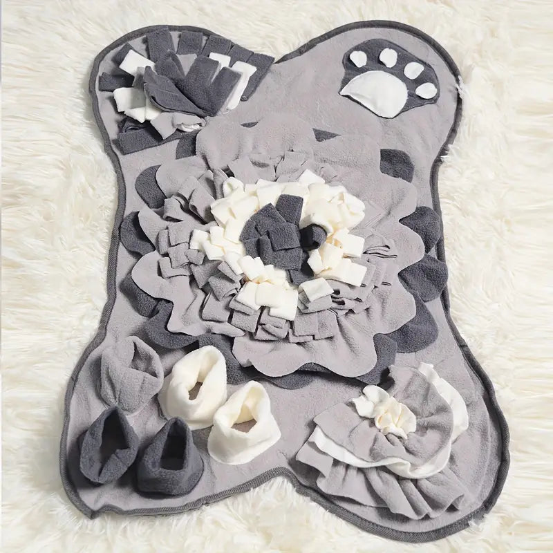 Dog snuffle mat with paw print design, featuring layered gray and white fleece fabric for interactive pet play and mental stimulation.