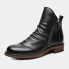 Black leather ankle boot with side zipper, wooden sole, and sleek design. Perfect for men's fashion, casual wear, and stylish footwear enthusiasts.