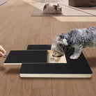 Dog using interactive puzzle toy with treats on wooden floor; pet enrichment, mental stimulation, and training tool for dogs.