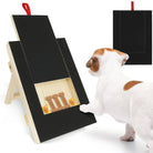 Dog using a wooden scratch board with treats; pet grooming tool for nail care. Includes bone-shaped treats. Ideal for dog nail maintenance.