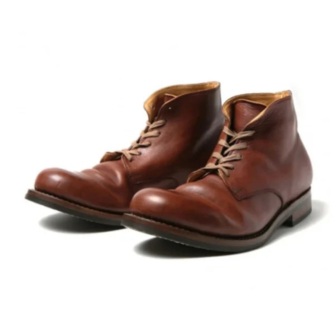 Brown leather lace-up boots with a polished finish, featuring a classic design and sturdy sole. Ideal for men's fashion and casual wear.