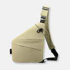 Cream-colored crossbody sling bag with adjustable strap, modern geometric design, and secure buckle closure. Ideal for travel and daily use.