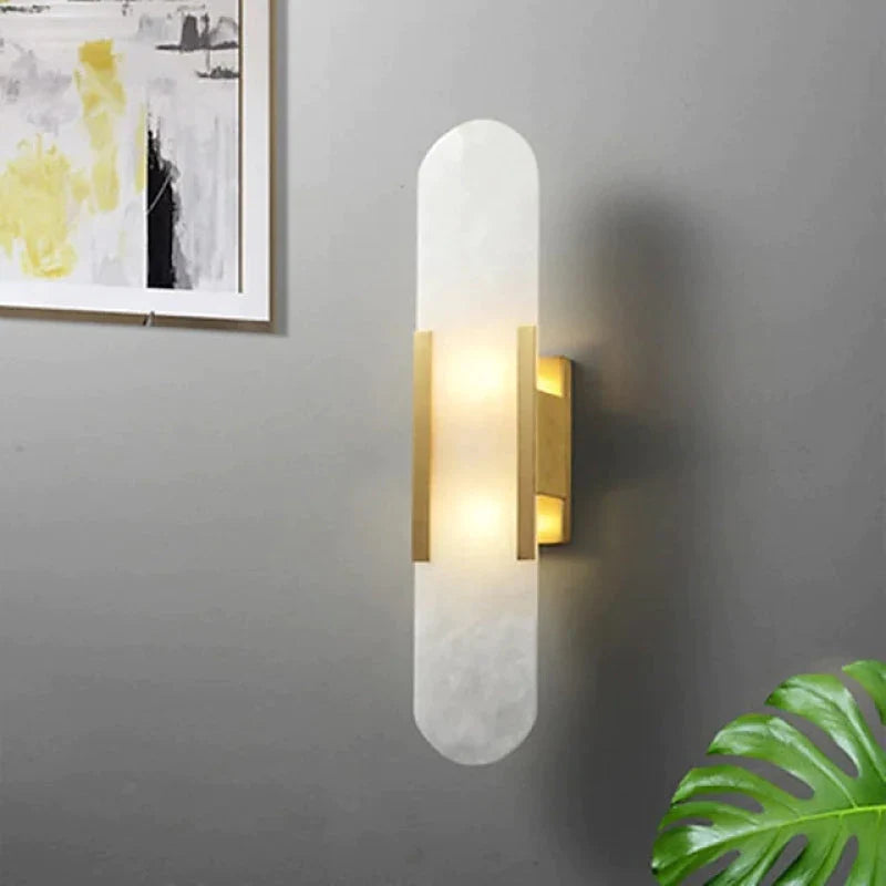 Modern black and gold wall-mounted reading light sconce with sleek design, illuminating a contemporary room. Perfect for stylish home decor.