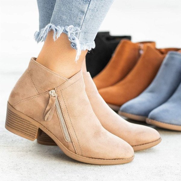 Beige ankle boots with zipper and cushioned footbed, women's fashion footwear, displayed with blue jeans, surrounded by black, brown, and blue boots.