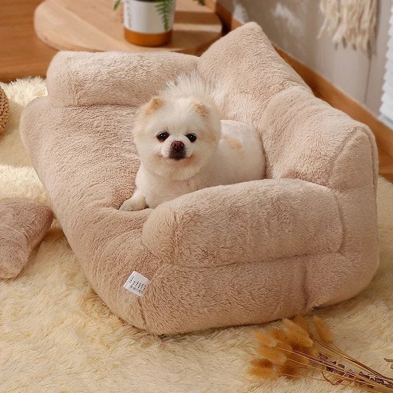 Fluffy dog resting on a plush, beige luxury pet bed. Cozy winter cat nest, perfect for small to medium dogs and cats. Comfortable pet furniture.